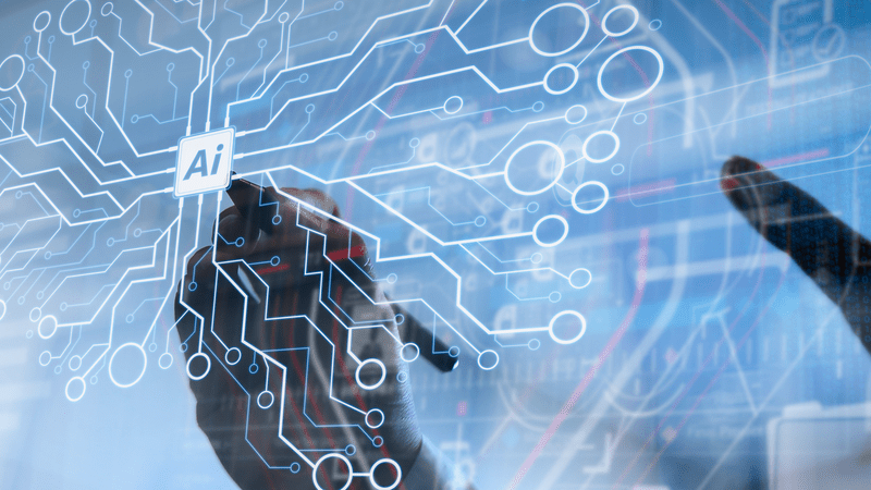 A person using a touch screen pen interacting with a computer screen with circuit board diagram on the screen with the word AI at the centre.