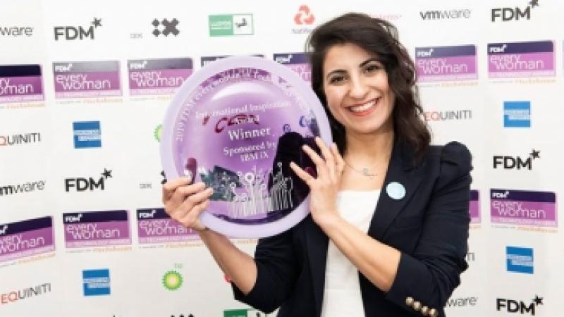 Mujde Esin holding her award