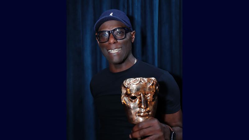 Mykaell-Riley-holding-a-BAFTA-award