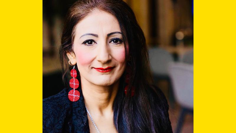 Image of Professor Nitasha Kaul on a yellow background.