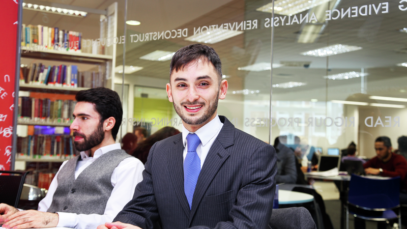 Postgraduate student at desk