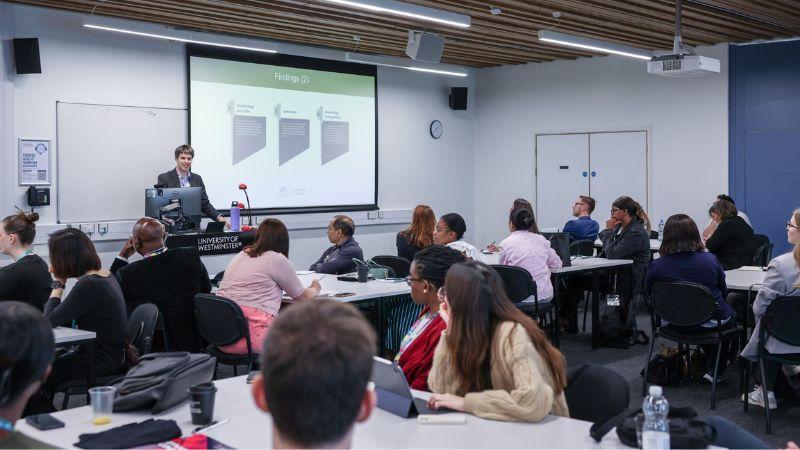 Event attendees watching a presentation in a classroom