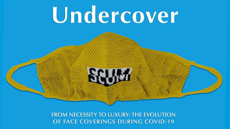 Promotional image for Undercover exhibition by Westminster Menswear Archive showing yellow face mask against blue background