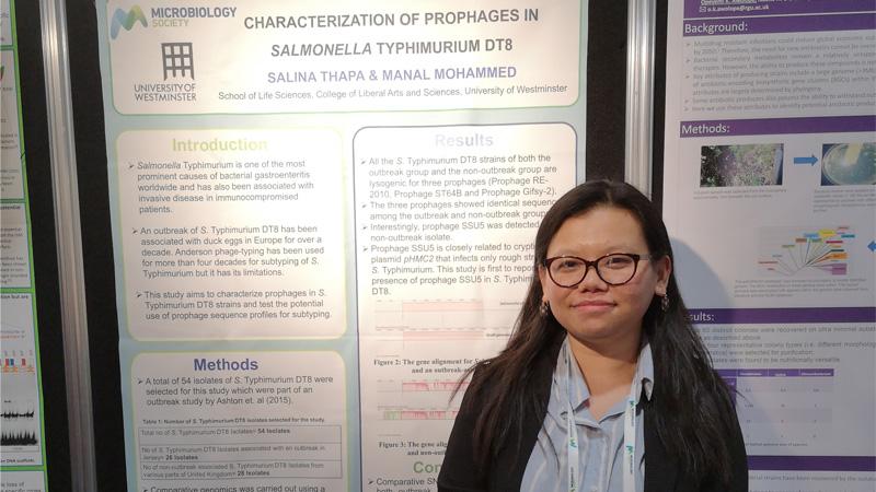 Medical Microbiology student Salina Thapa stood in front of her work