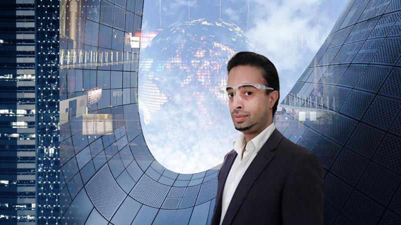 Savraj Matharu wearing goggles in front of a tech background