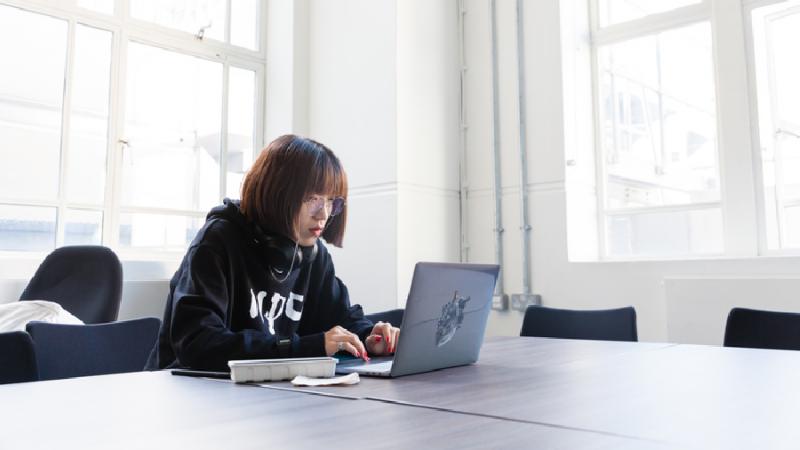 A student working on a laptop