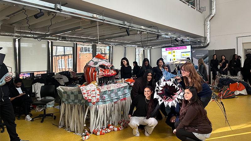 Student team posing with their monster