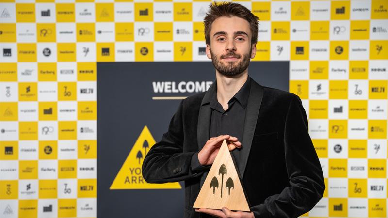 Tomás Felício Oliveira poses with his Young Arrows trophy.