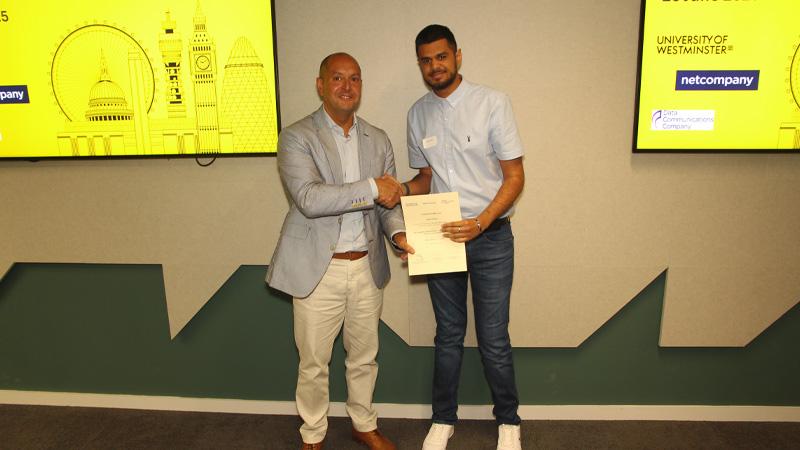 Ajay Dhillon receiving his certificate for the Social Impact award
