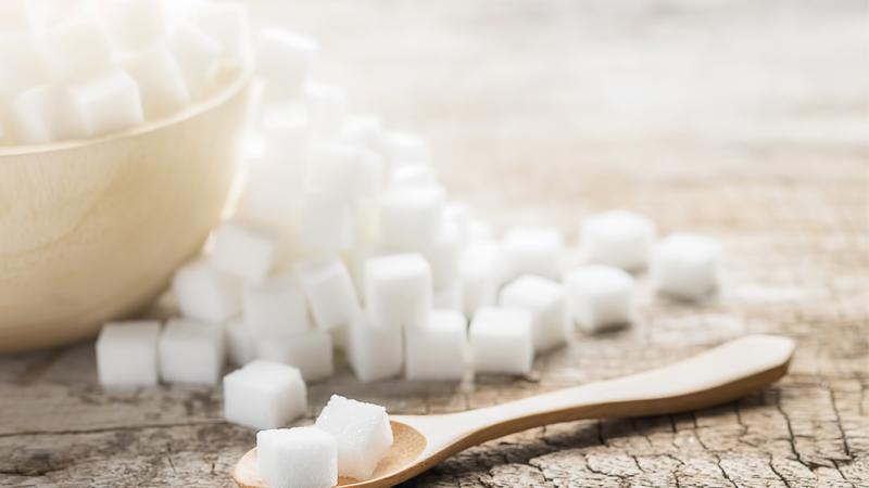 Overflowing bowl of sugar cubes