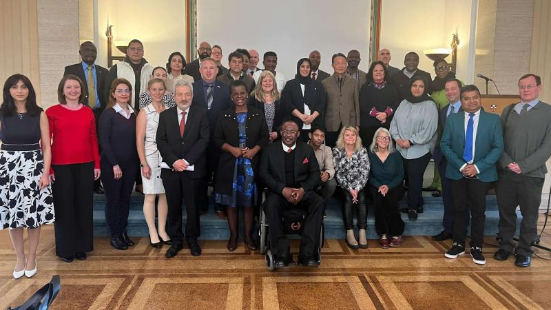 Photo of Dimah Ajeeb and delegates posing for a group photo at the GCPR conference