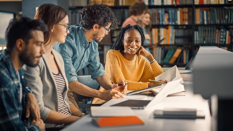 Group of students studying in the library