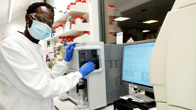 Dr Mustapha Bittaye wearing mask in lab