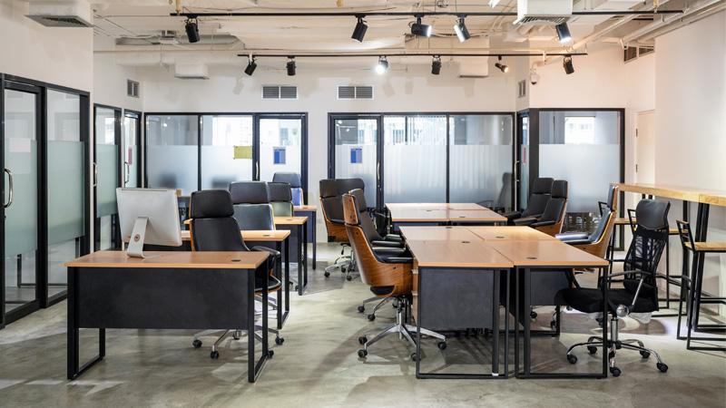Empty modern office with desks and chairs