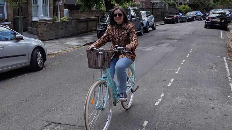 Student Georgia Corr riding bike on road