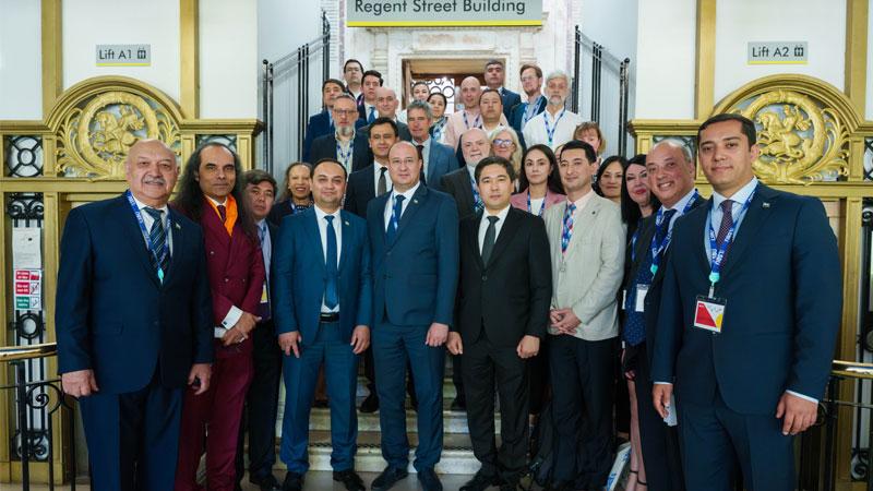 Group photo of some attendees at the UK-Uzbekistan Education Forum in the historic staircase of Westminster's Regent Street Building.