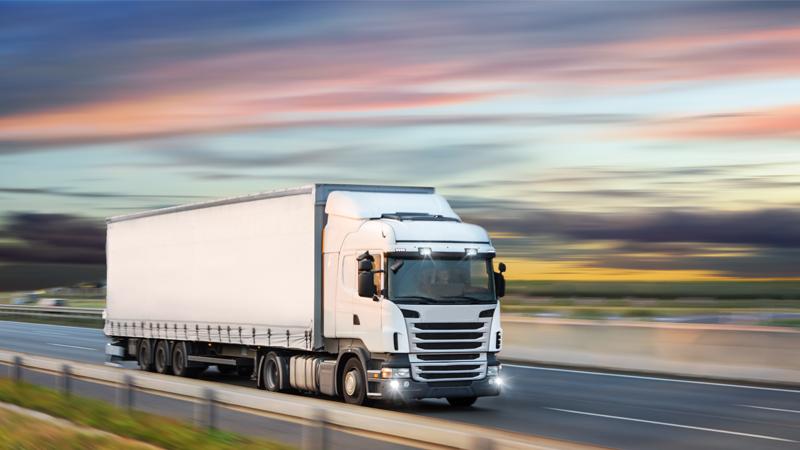 HGV lorry driving down road