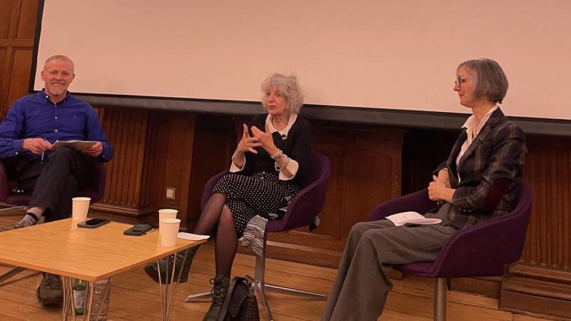 Susie Orbach (centre) sitting in a panel with Professor Damien Ridge (left) and Dr Alison Fixsen