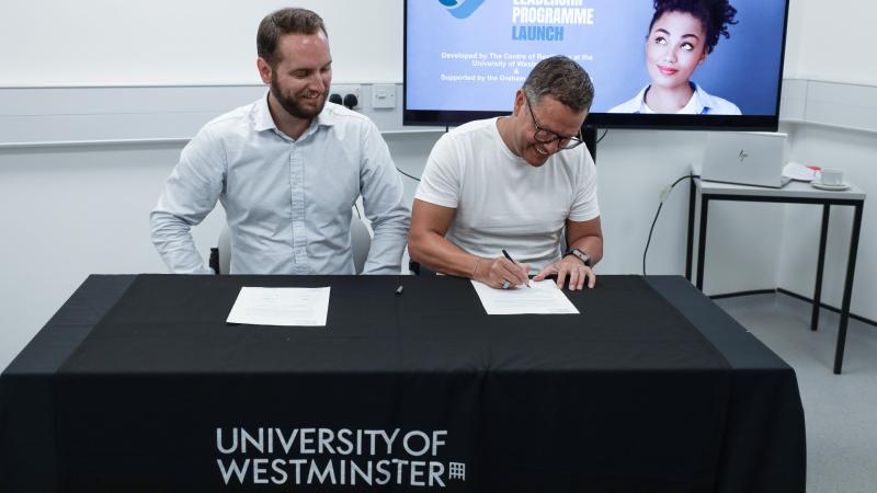Jordan Scammell and Graham Shapiro signing agreement
