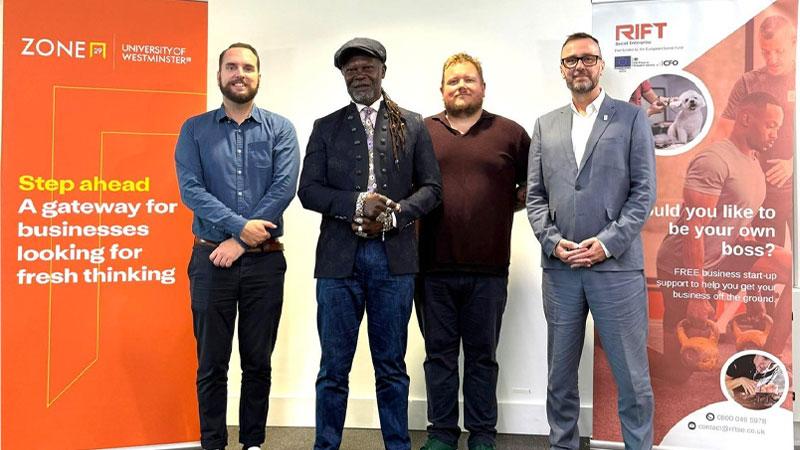 Photo of the Westminster and RIFT team with Levi Roots in front of Zone29 signage.