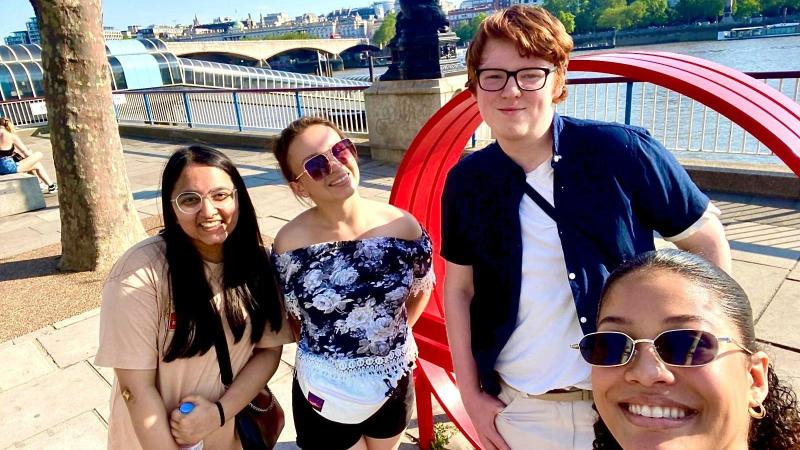 Students taking a selfie on the south bank of the River Thames while on the London Legal Walk