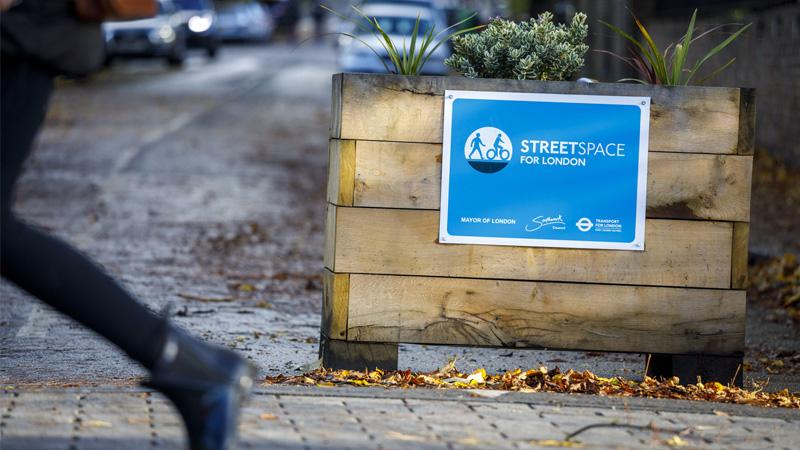 Planter with streetspace sign on street installed as part of Low Traffic Neighbourhood scheme
