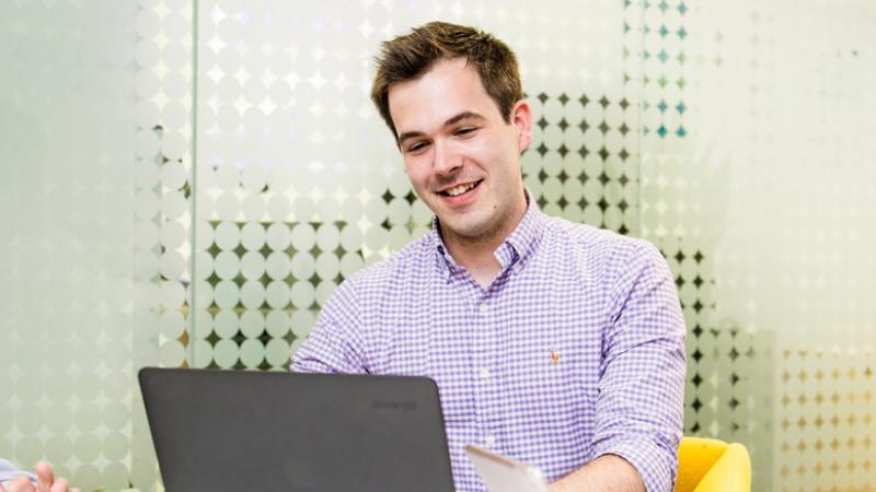 Male student using a laptop