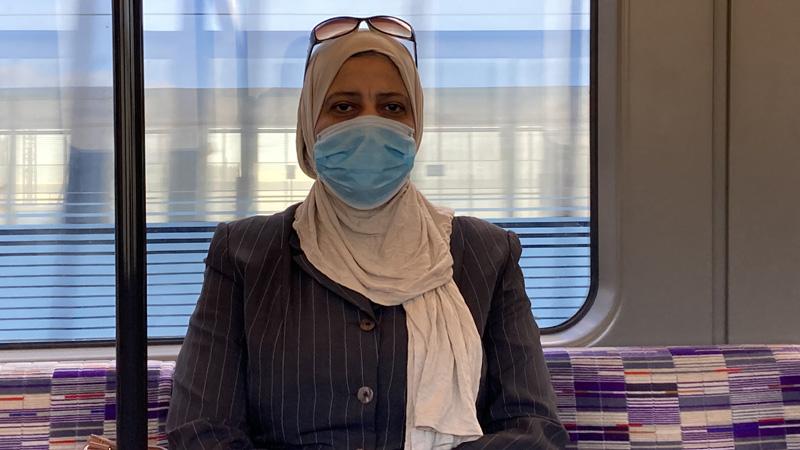 Dr Manal Mohammed on the tube in London wearing a face mask