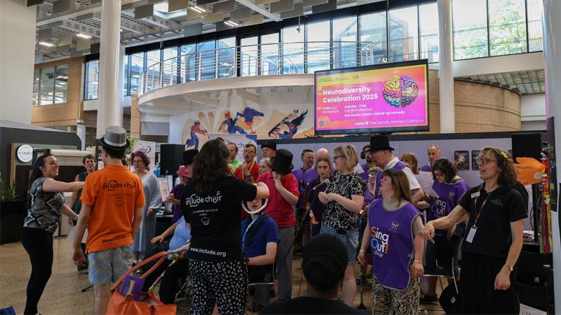 Choirs singing together at the Westminster Neurodiversity Celebration