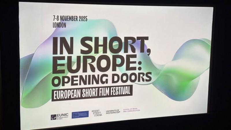 Photo of cinema screen reading: IN SHORT, EUROPE: OPENING DOORS EUROPEAN SHORT FILM FESTIVAL