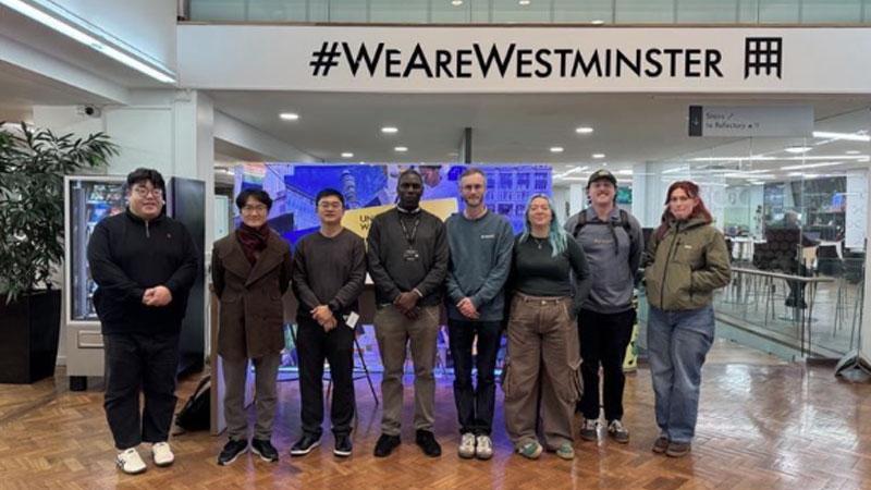 Photo of the MET-Biofuels team in front of a sign which reads #WEAREWESTMINSTER