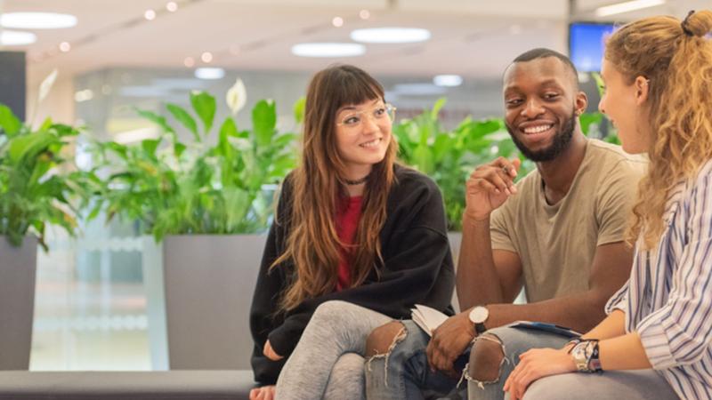 Three students talking