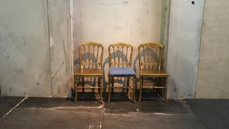 Image of three gold chairs