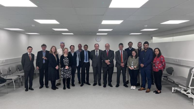 Group of Westminster staff stood in a line with Carlos and Marcelo in the middle