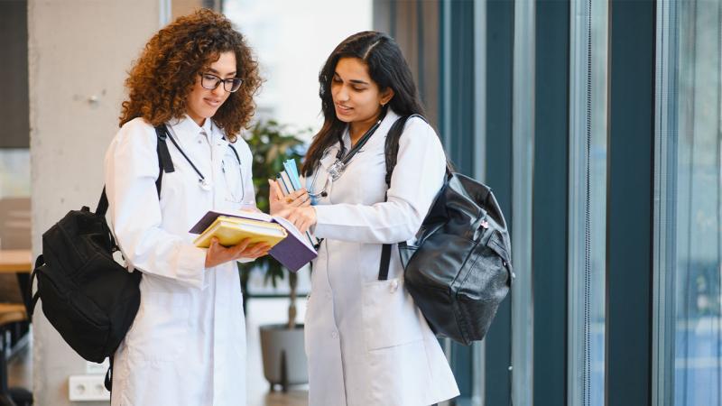 two medical students talking