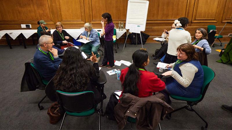 Members of the UWCA in a group discussion