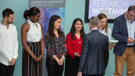 Three Minute Thesis contestants receiving prizes