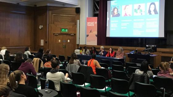 A panel of females talking to an audience