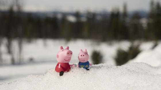 Peppa pig sitting in snow