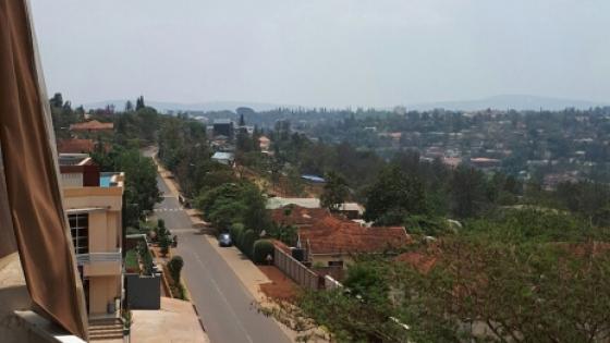 The view from a window in Rwanda, looking out to a green landscape