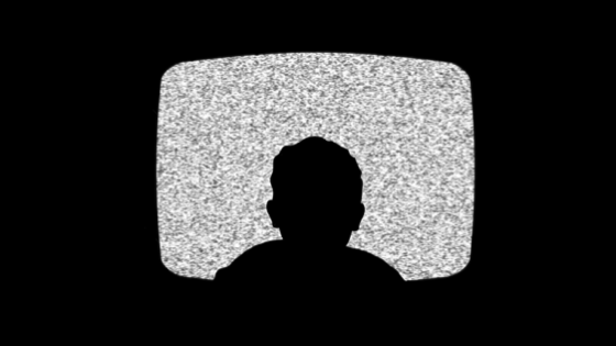 Silhouette of a child in a television screen