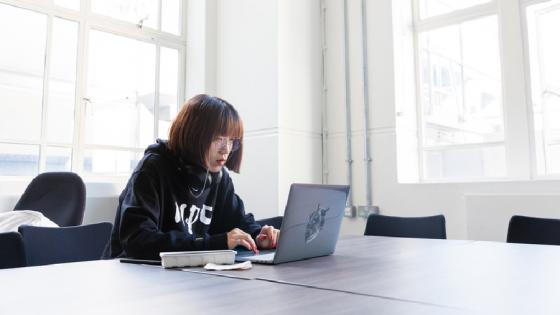A student working on a laptop