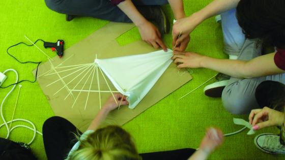 students building a model during architecture summer school