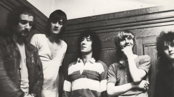 Black and white group photo of band Fleetwood Mac in the dressing room, now the near end of the cafe area, in Westminster's Little Titchfield Street building