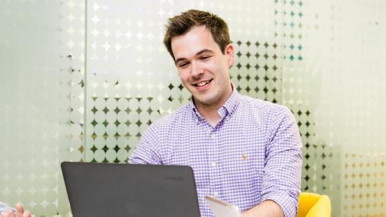 Male student using a laptop