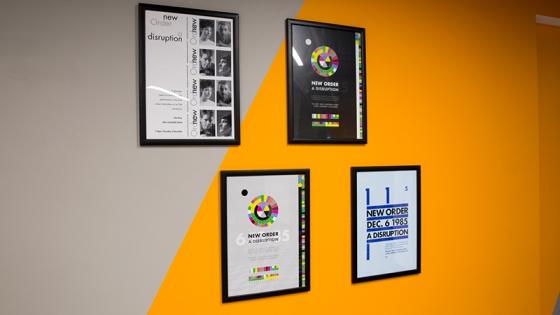Four hanging posters of the groups New Orders of Disruption