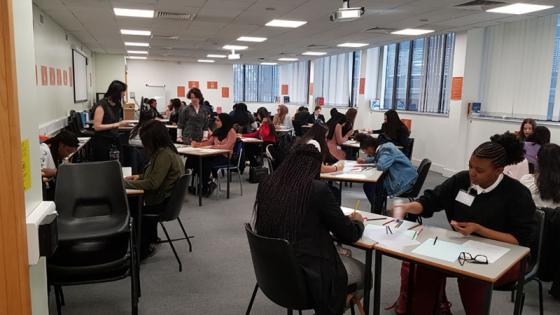 Students experiencing the Human Library Project, sitting in a classroom and working together