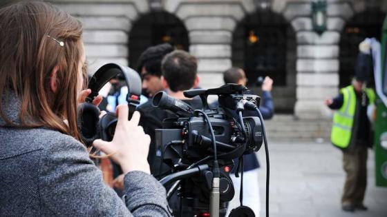 Picture of a girl filming using film equipment