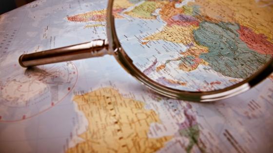 Magnifying glass on map of Europe