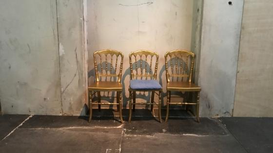 Image of three gold chairs